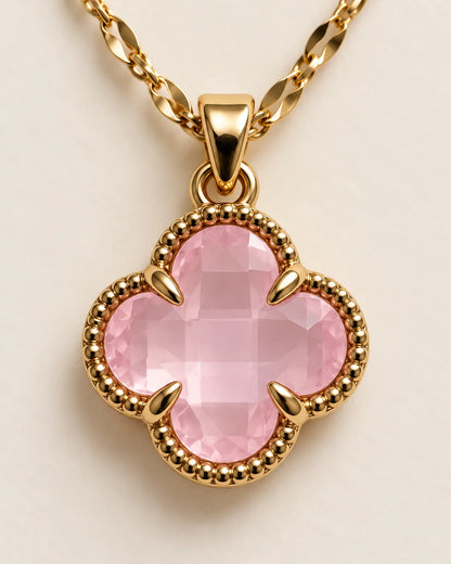 Close-up of the Fortuna baby pink clover pendant showing the faceted stone and claw setting