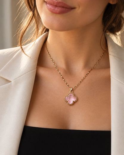 Model in a cream blazer wearing the dainty Fortuna baby pink clover necklace