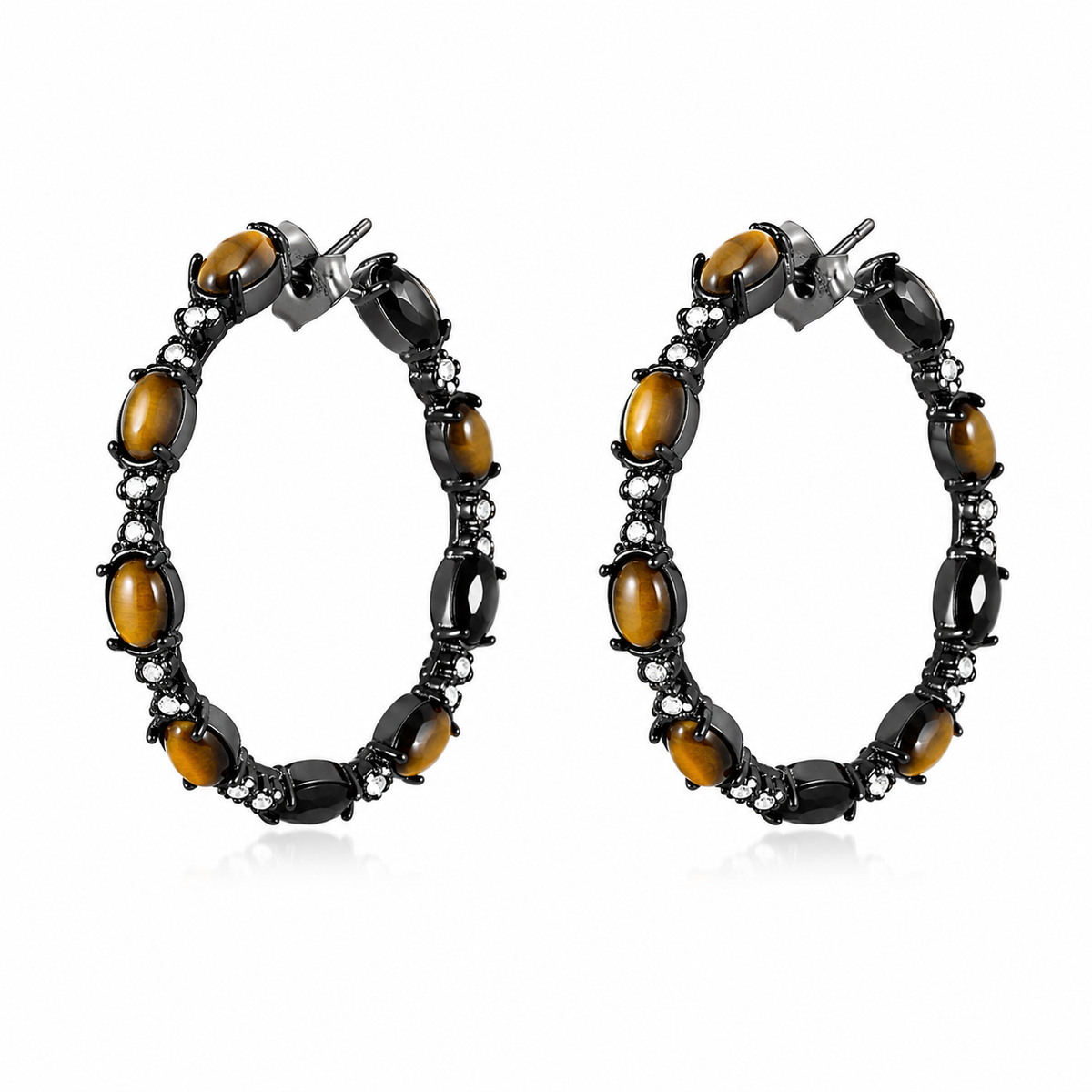 A pair of large oval hoop earrings featuring polished amber-brown tiger's eye stones set in black metal with small clear accent stones, shown on a plain white background.