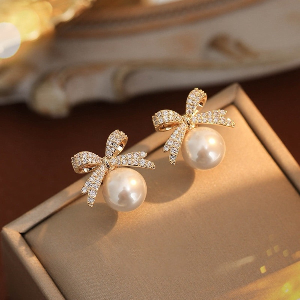 Elegant Rhinestone Bow and Pearl Stud