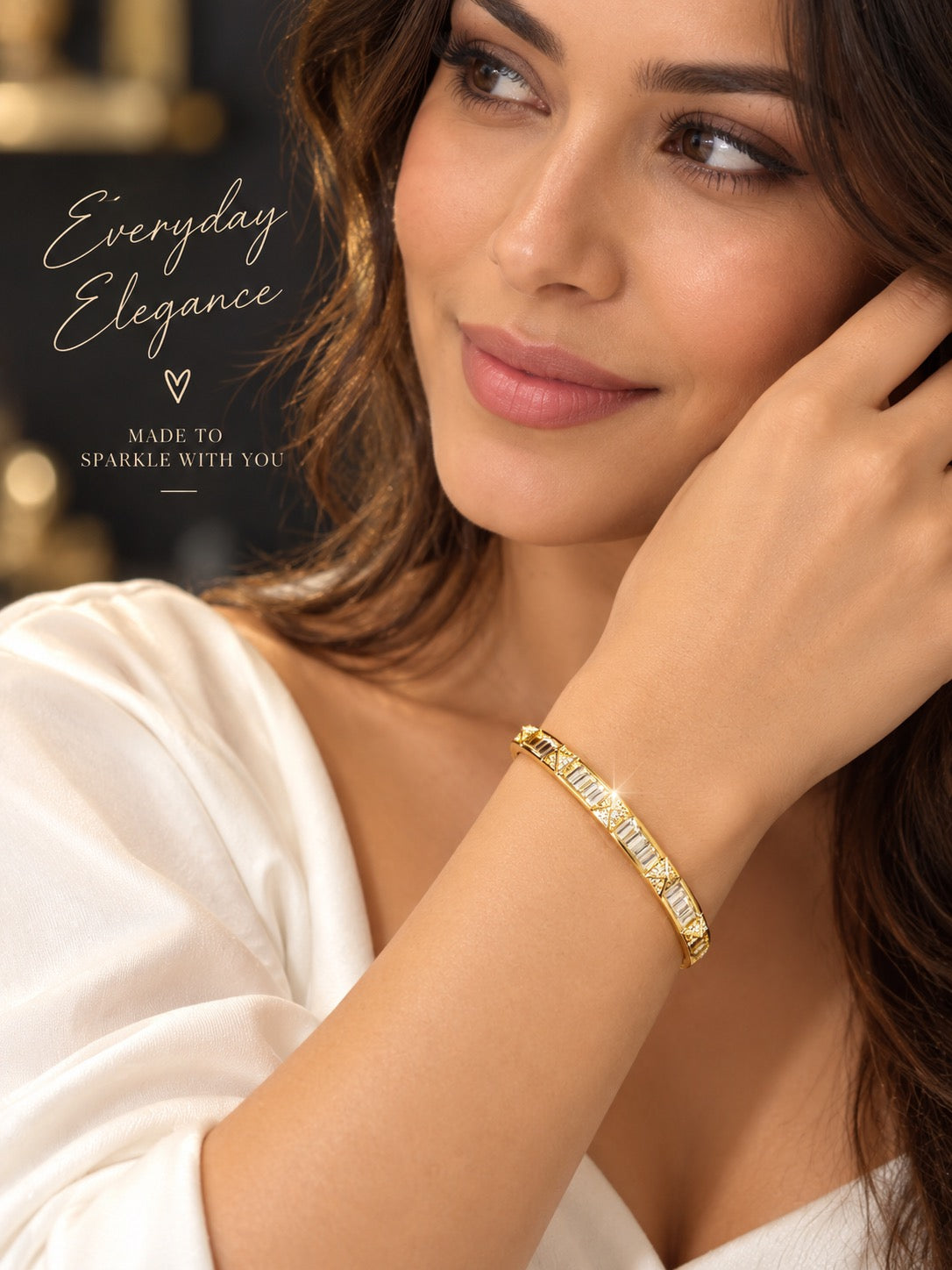 Celeste Gold Baguette Crystal Bracelet with rectangular crystals and sparkling geometric details.Woman wearing Celeste Gold Baguette Crystal Bracelet by Trinkets by Emily.