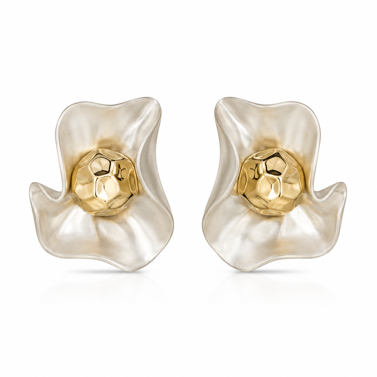 A pair of sculptural flower-shaped earrings made of iridescent white resin with a faceted gold center, shown on a clean white background.
