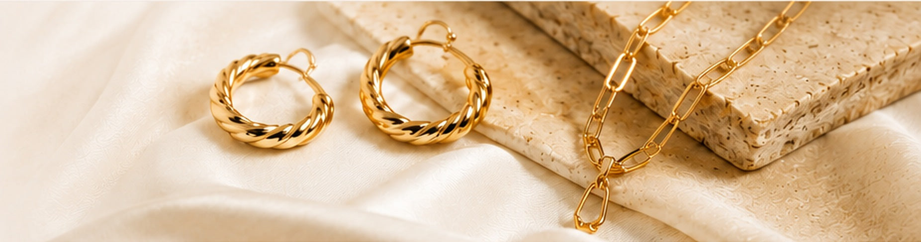 Gold earrings and necklace by Trinkets by Emily